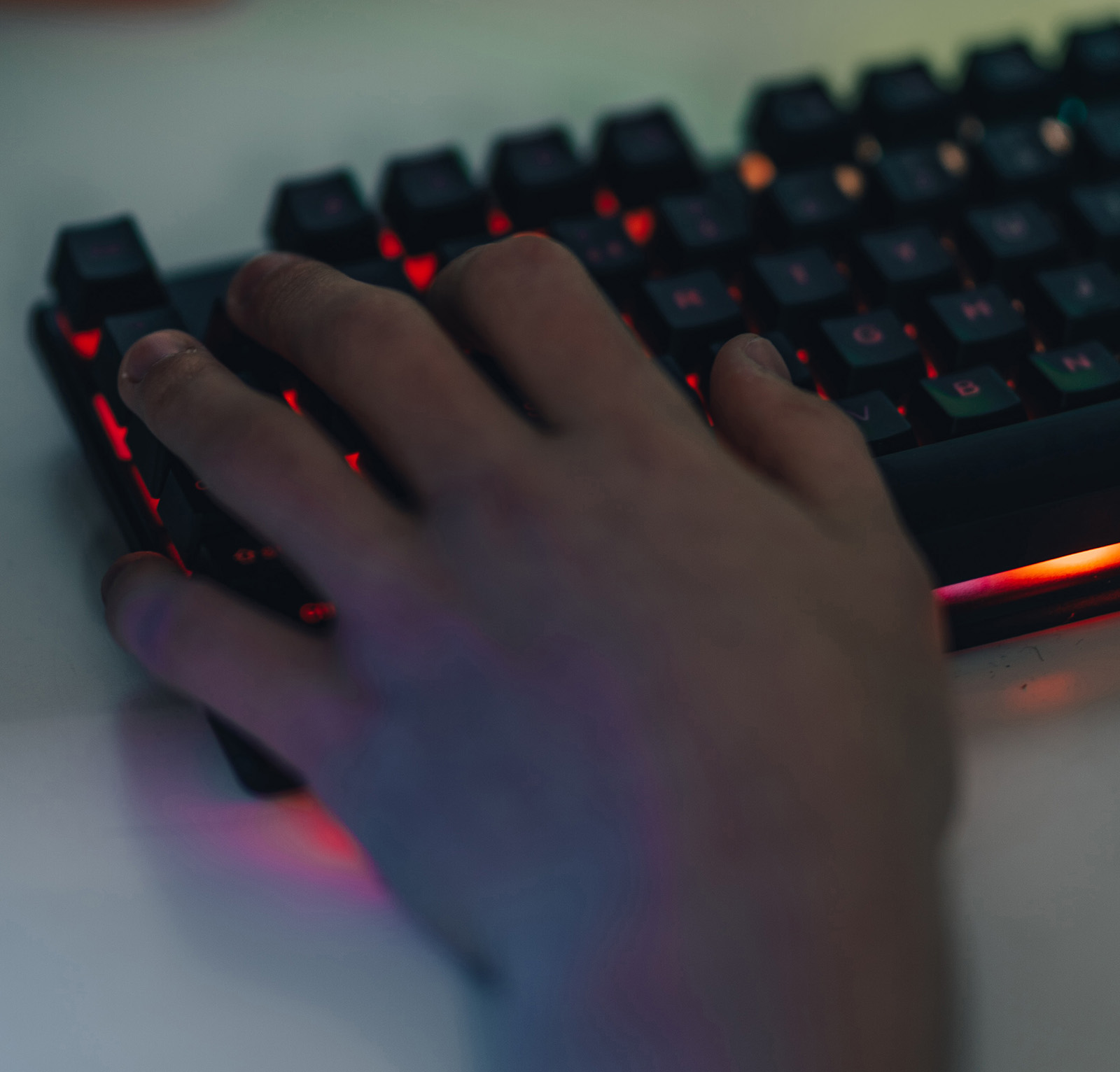 Illustration image of a hand on a gamer keyboard