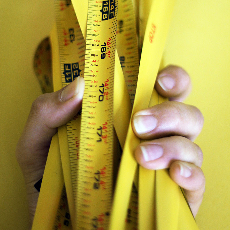 Illustration image of hand holding a measuring tape